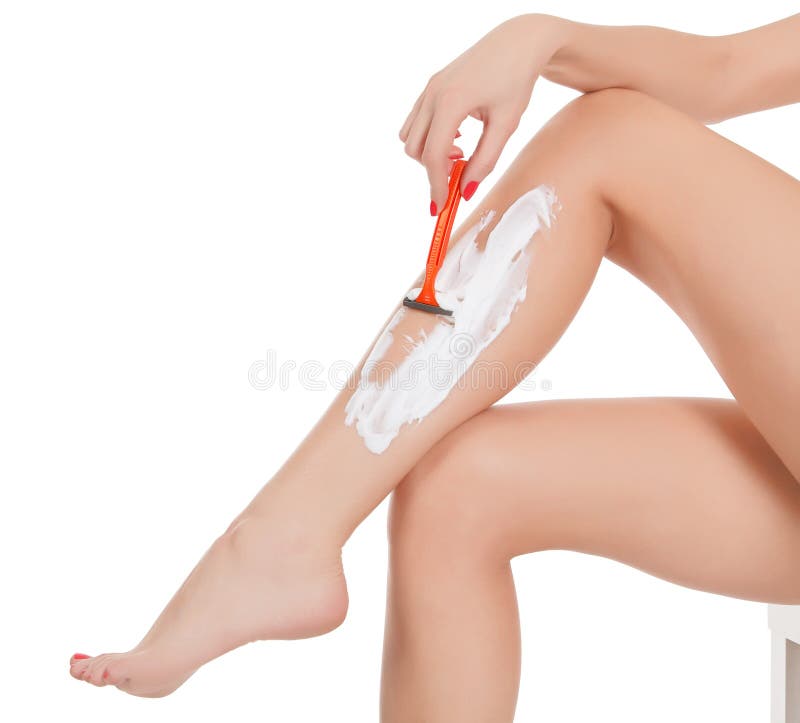 Woman shaving her legs stock photo. Image of pampering 27881620