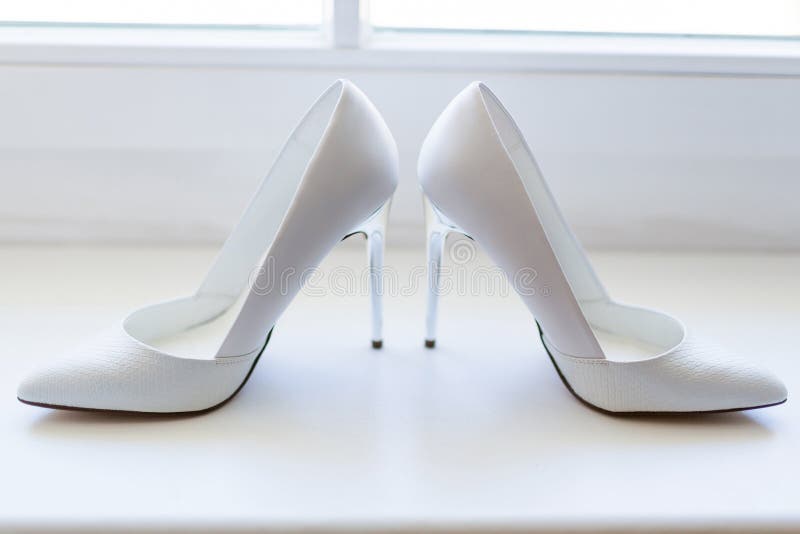 White shoes in high heels stock image. Image of pair - 68585899