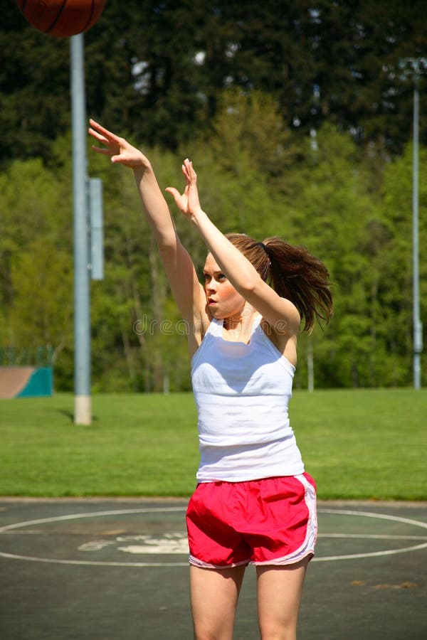 Woman shooting basketball stock photo. Image of recreation 5338336