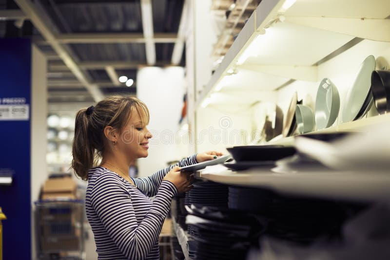 Woman shopping for furniture and home decor royalty free stock images Woman shopping for furniture and home decor royalty free stock images