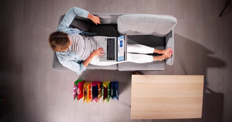 Woman shopping online on laptop ecommerce customer fotografia de stock