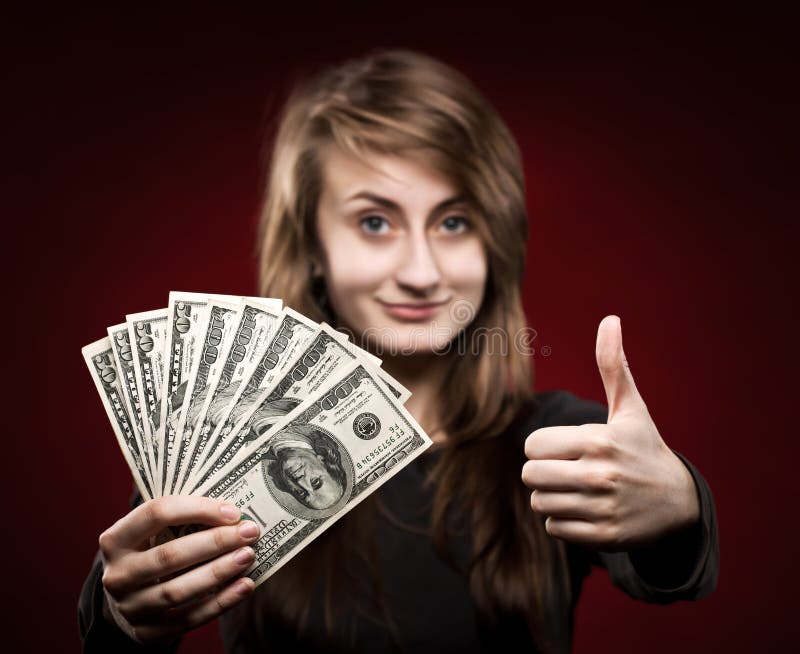 Woman showing fan of money