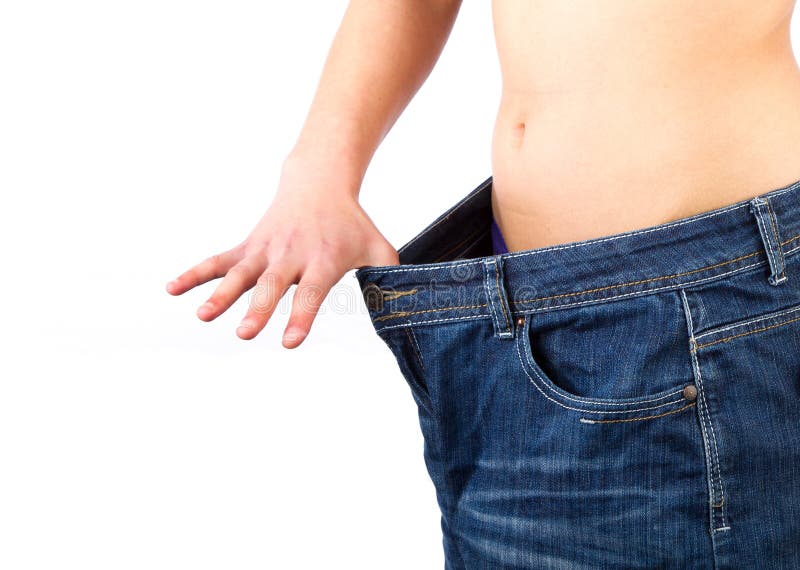 Woman showing how much weight she lost royalty free stock photo