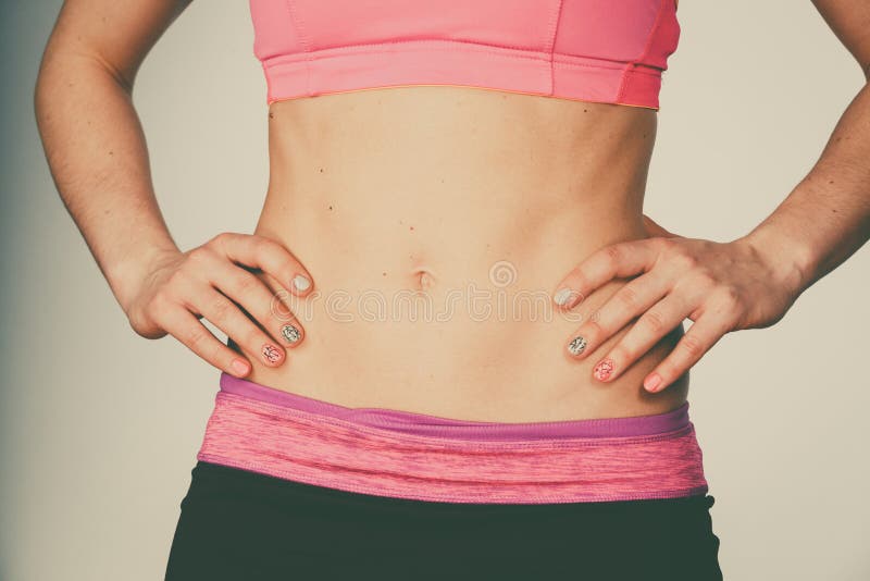 Woman Showing Some Strong Abs and Flat Belly Stock Image - Image of close,  pain: 78894097