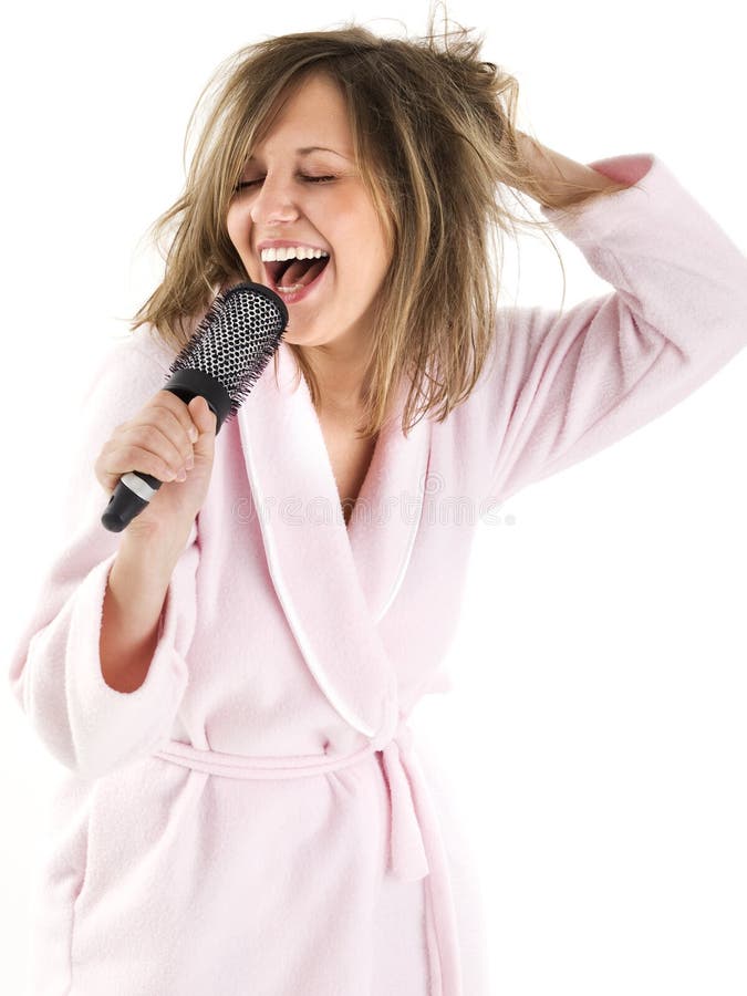 Woman singing with hairbrush isolated on white background