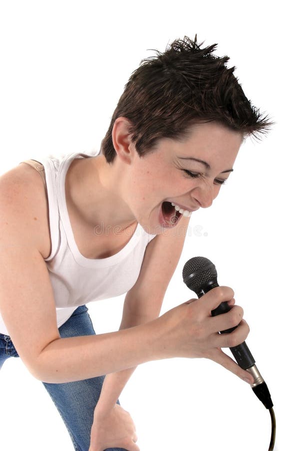 Beautiful woman singing into a microphone isolated on white background