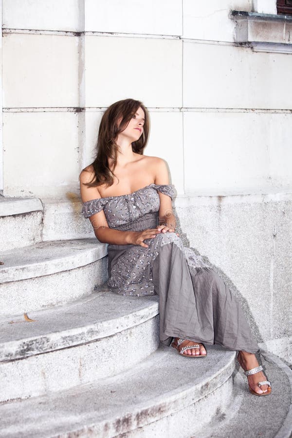 woman sit on stairs outdoor