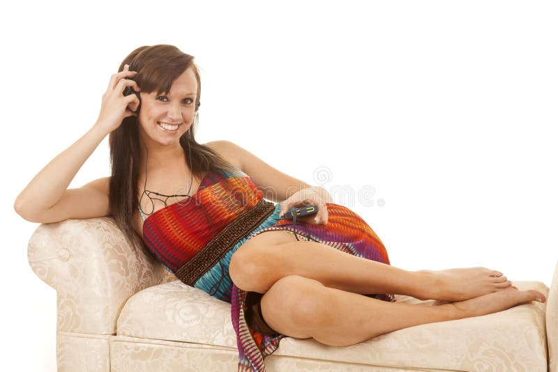 Woman sitting colorful dress side headphones listen