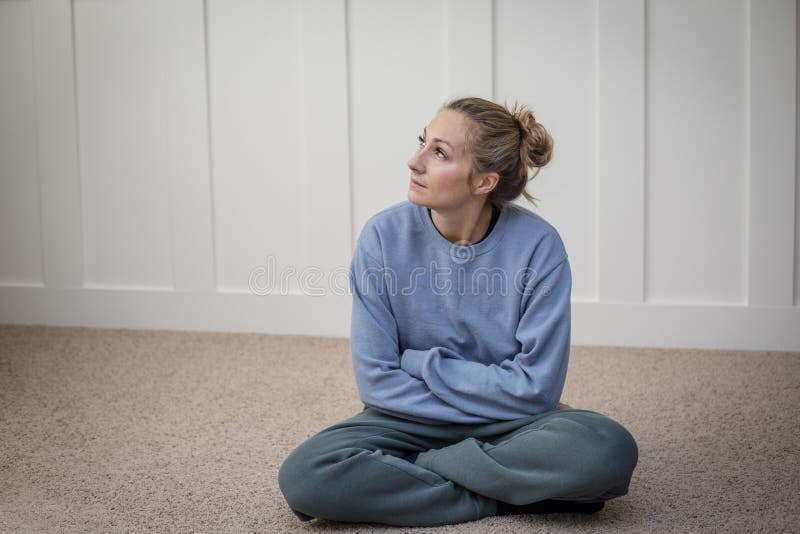 Woman sitting and contemplating life`s challenges