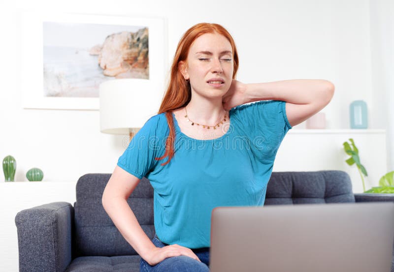 Woman Sitting on Couch Using Computer Suffers from Neck Pain Stock Photo Image of notebook