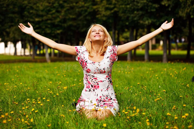 Woman sitting in the grass and Enjoy the sun