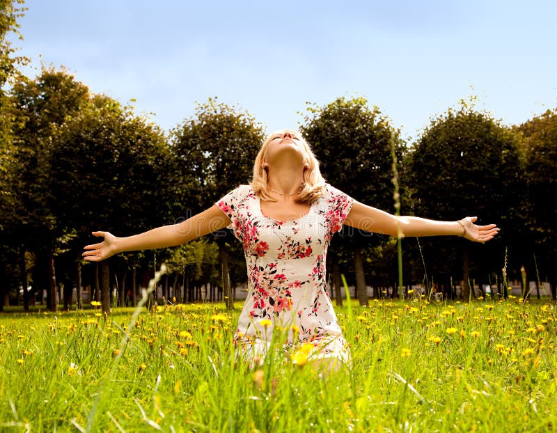 Woman sitting in the grass and Enjoy the sun