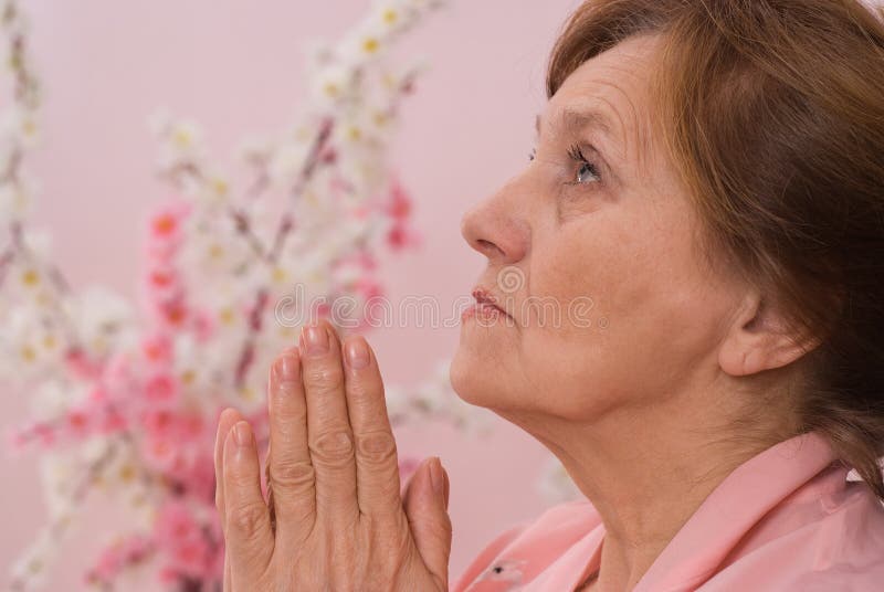 Woman sitting and praying