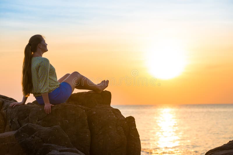 Woman Sitting On Rock Stock Photo Image Of Orange Holiday