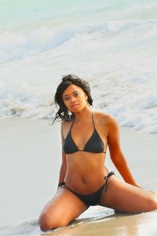 Woman sitting on the sand