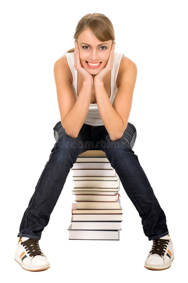 Woman sitting on stack of books royalty free stock photography