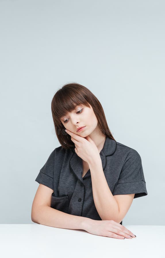 Woman Sitting at the Table and Thinking about Something Stock Image ...