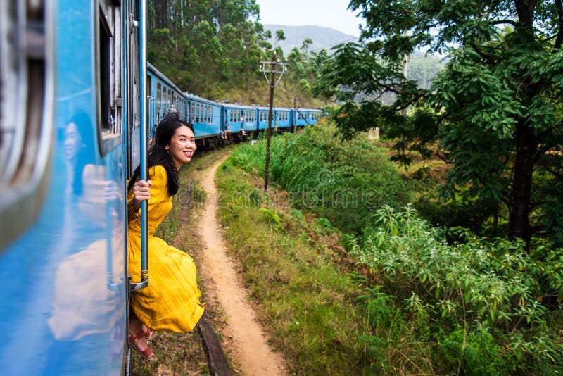 Woman sitting by the train door Sri Lanka stock images Woman sitting by the train door Sri Lanka stock images