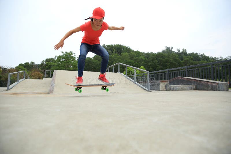 Woman Skateboarder Skateboarding at Skate Park Stock Image - Image of ...