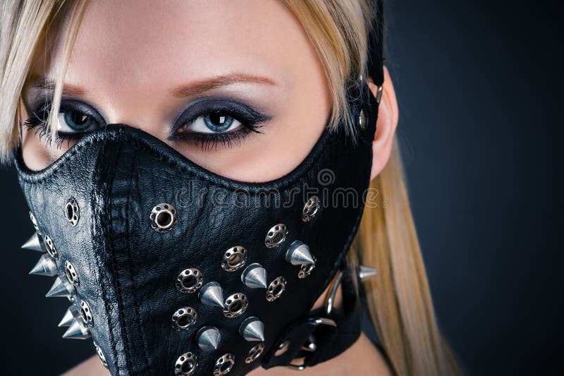 Woman slave in a mask with spikes