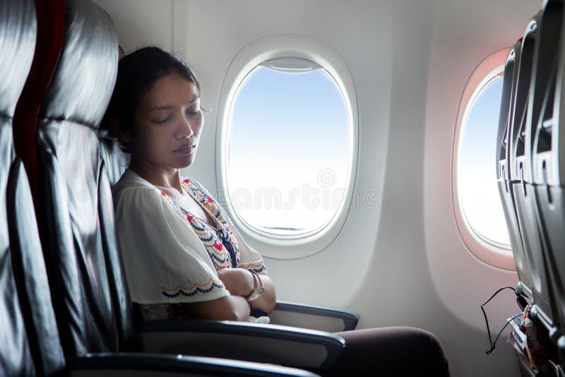 A Female Passenger Traveling by Plane Sleeping on Cushion Airplane Stock  Photo - Image of inside, person: 273342598