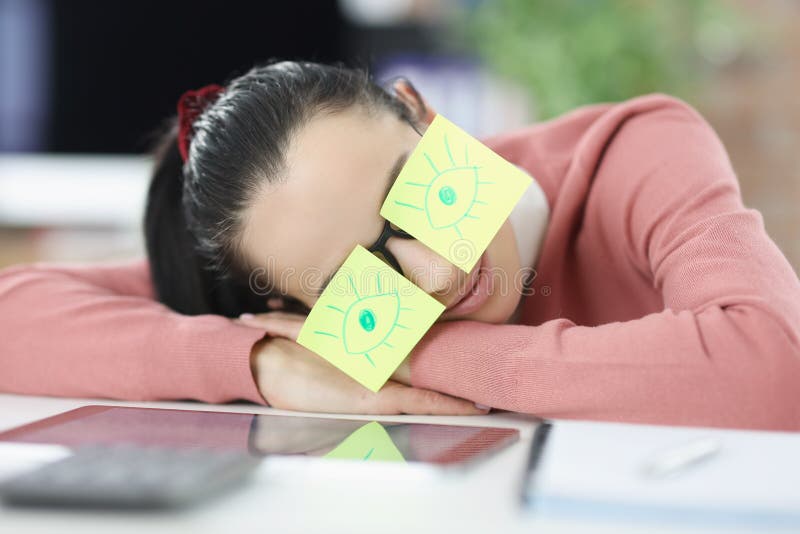 Woman is Sleeping at Workplace. Glasses Having Stickers with Painted