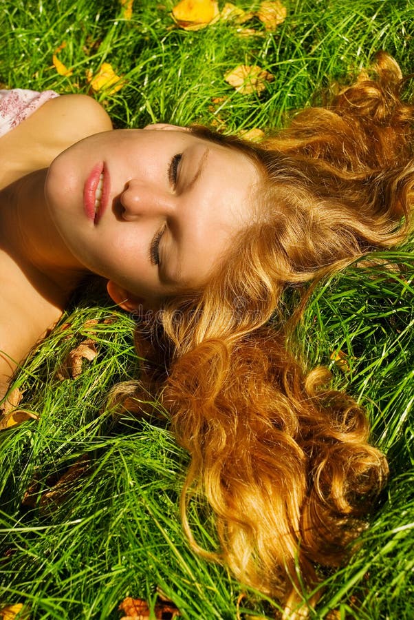 Woman sluging on grass