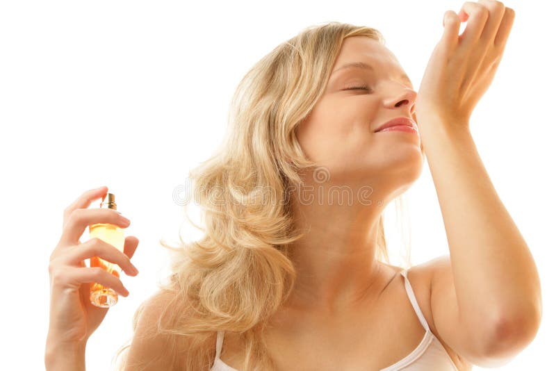 Woman smelling perfume from wrist royalty free stock photo