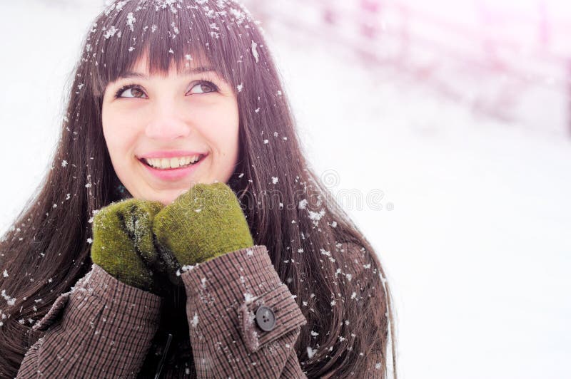 Woman smiling in snow portrait royalty free stock images
