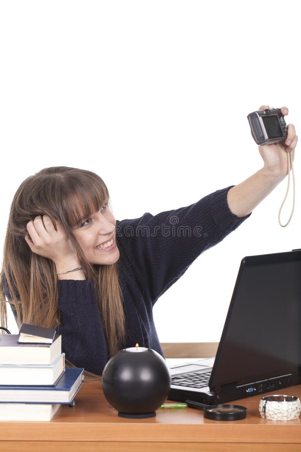 Woman smiling and taking pictures of herself