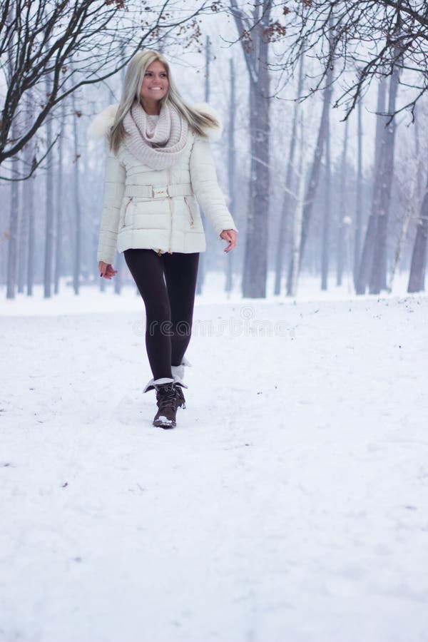 Woman smiling warmly clothed in winter