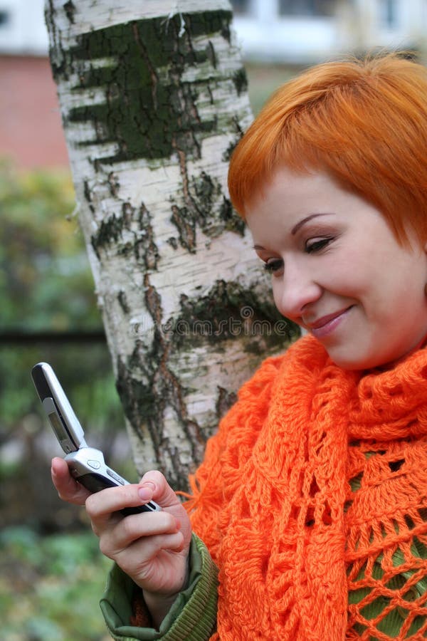 Woman is sms in mobile-phone