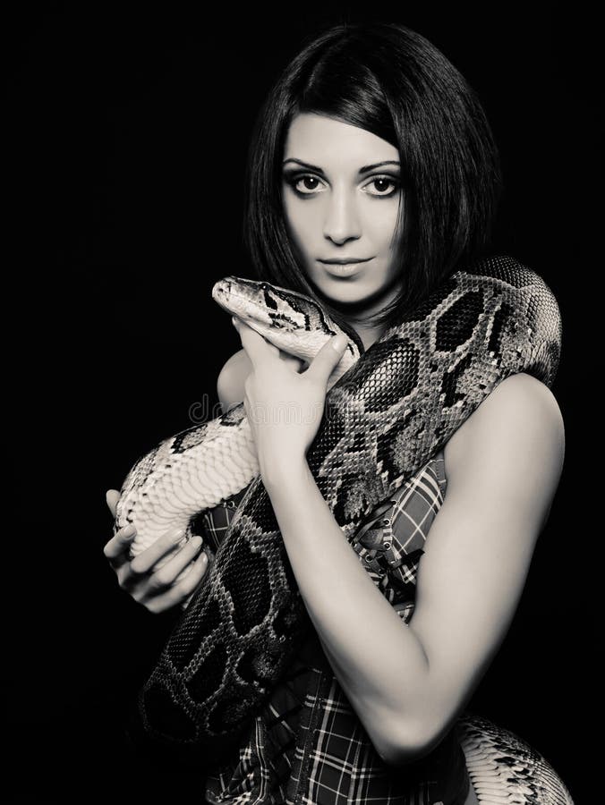 Woman with a snake stock image. Image of black, golden 26068275