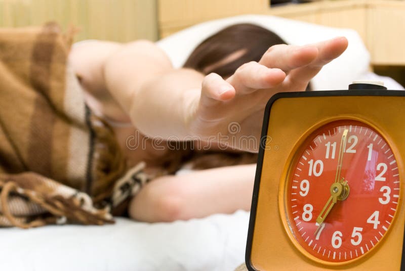 Woman Snoozing a Red Alarm Clock Stock Photo Image of snooze, leisure 10435752