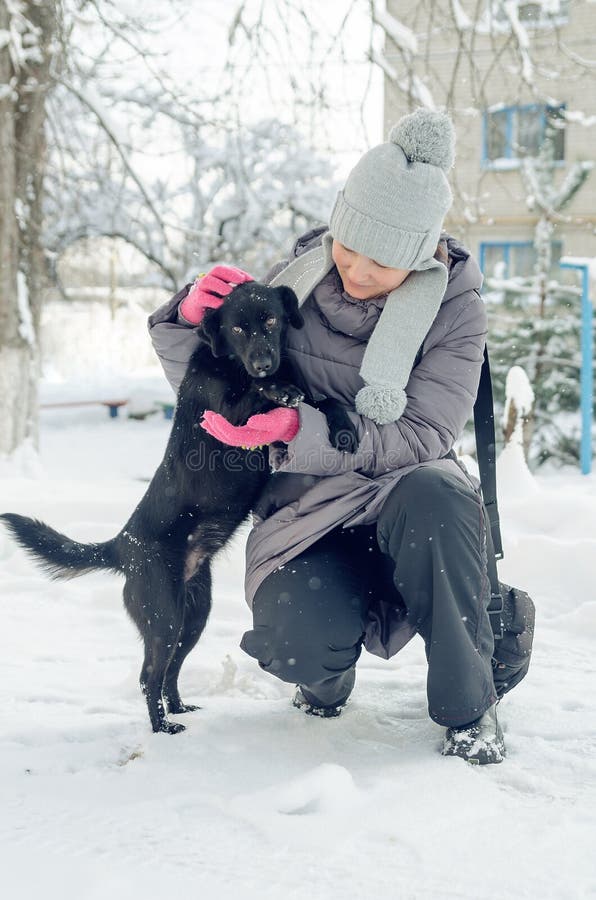 Woman snow dog