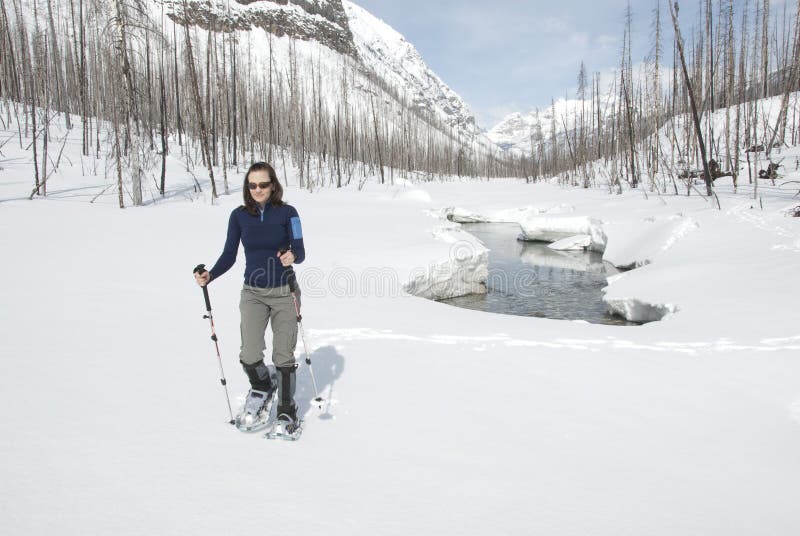 Woman snowshoeing in the Canadian rockies