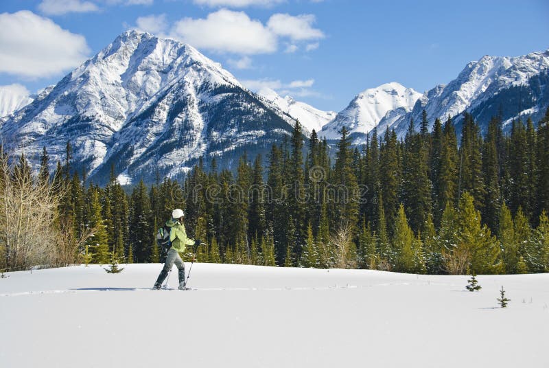 Woman snowshoeing in the Canadian rockies