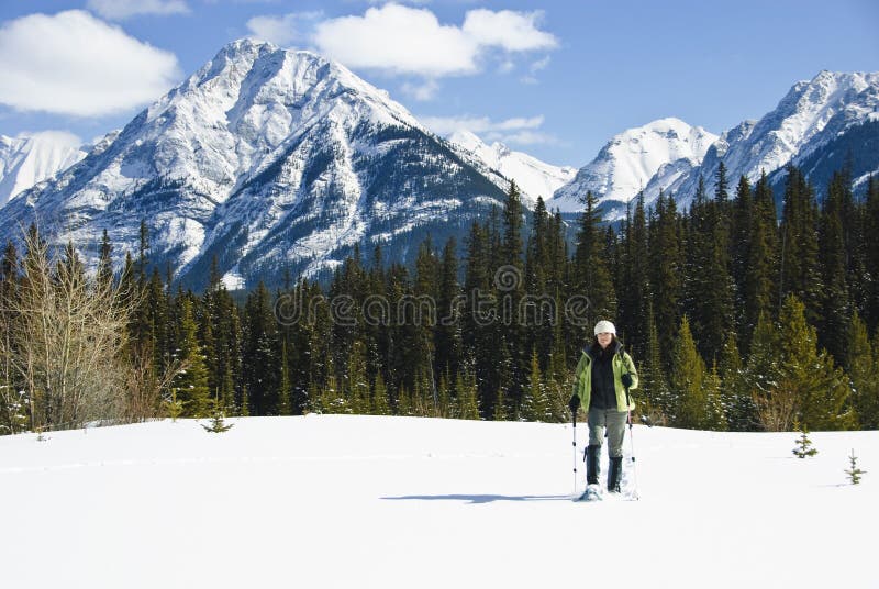 Woman snowshoeing in the Canadian rockies