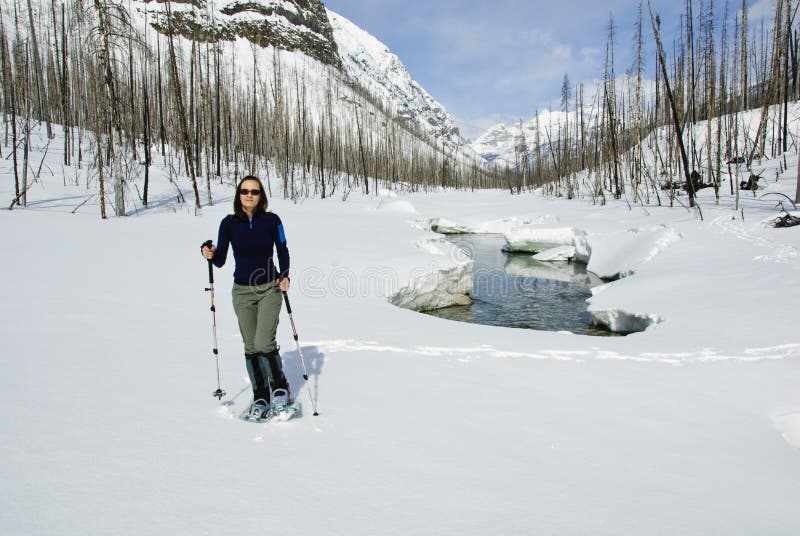 Woman snowshoeing in the Canadian rockies