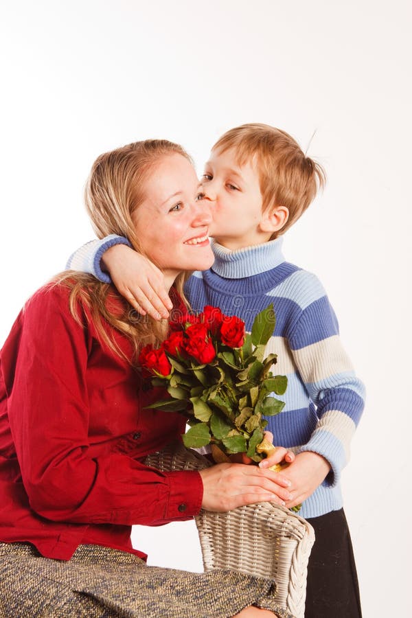 Woman with a son and with the bouquet of red roses