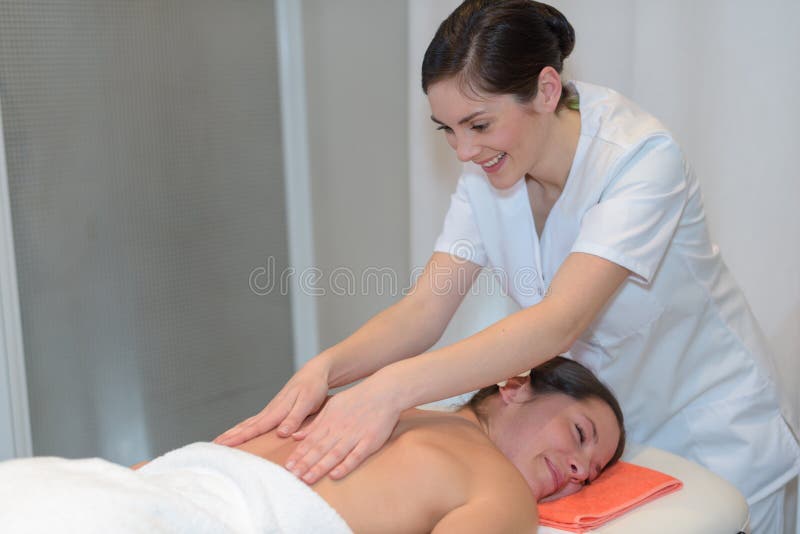 Woman in spa salon getting massage