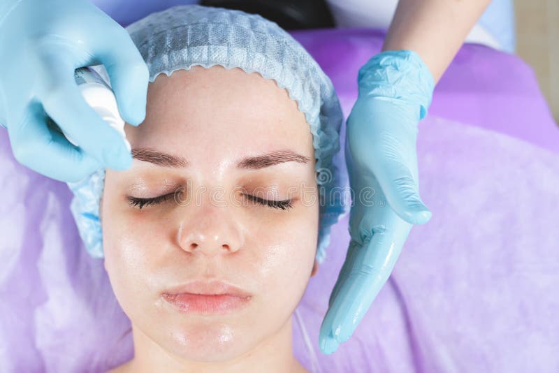 Woman In Spa Salon Receiving Face Treatment With Facial Cream Stock Image Image Of Cream