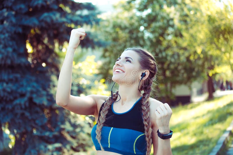 Woman at sports cheerful pumping fists smiling royalty free stock image Woman at sports cheerful pumping fists smiling royalty free stock image