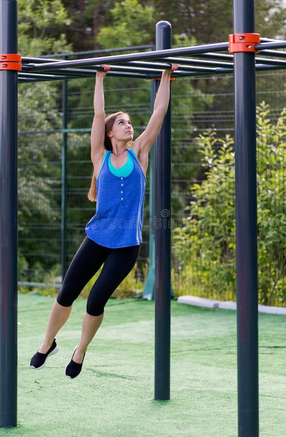 Woman in sportswear on the playground stock images Woman in sportswear on the playground stock images
