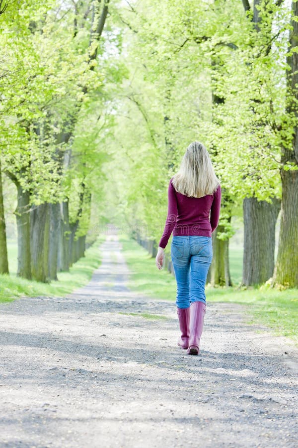 Woman in spring alley