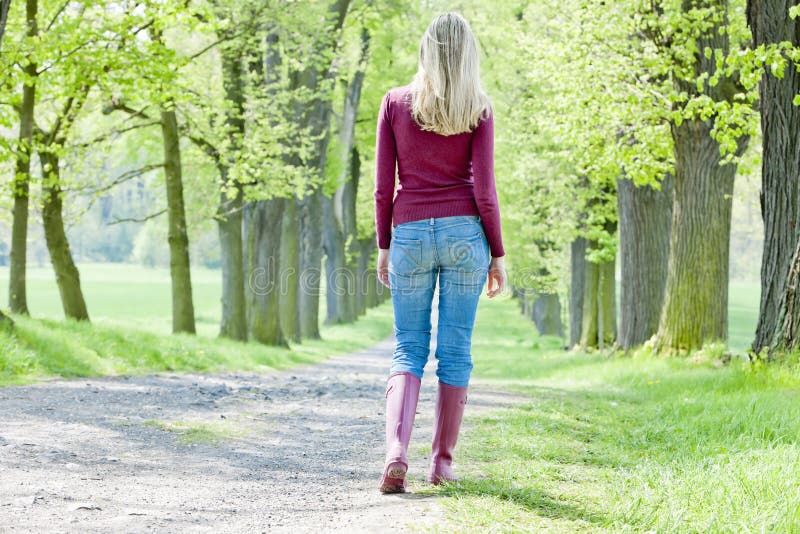 Woman in spring alley