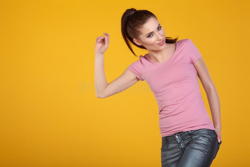 Young Woman with spring hat against yellow background