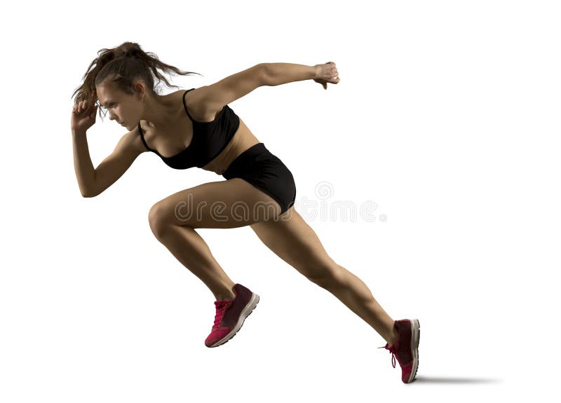 Woman sprinter leaving starting on the athletic track royalty free stock photo