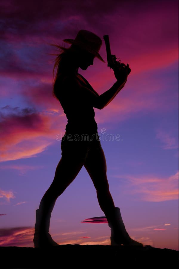 Woman stand gun silhouette