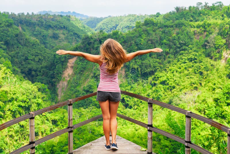 Woman Stand on Overhanging Bridge on High Cliff Above Jungle Stock ...